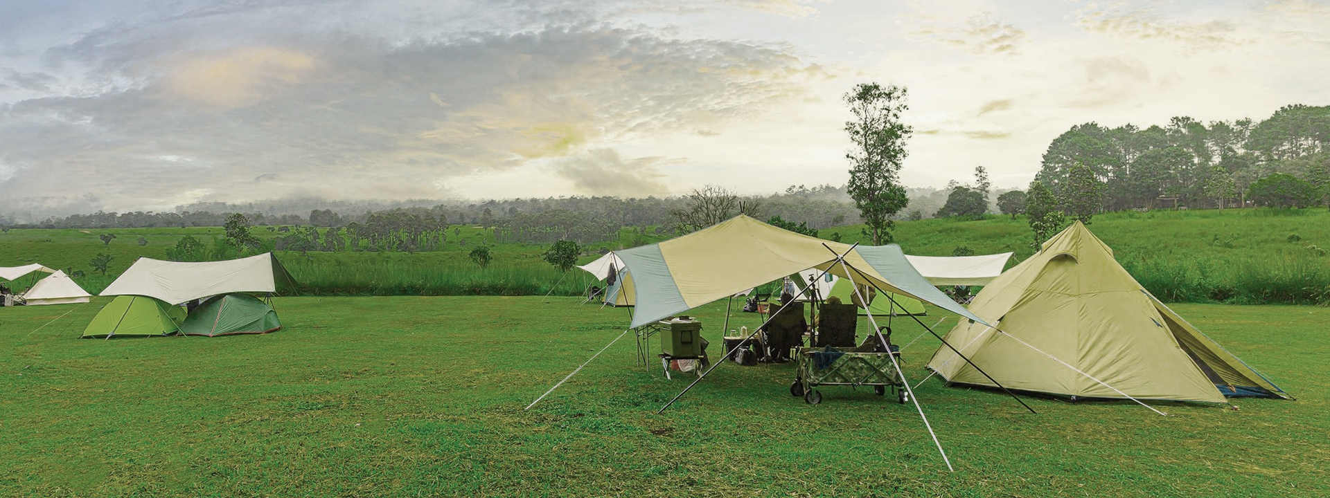 campinggolden-sunrise-illuminated-camping-tent-dramatic-mountain-landscape-panorama-thailand