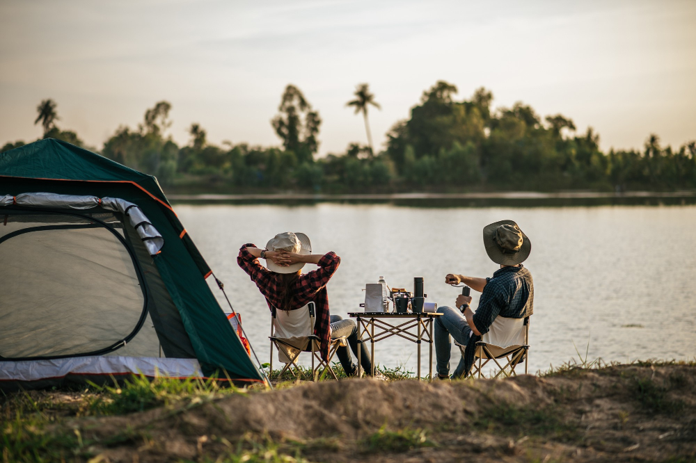 rear-view-young-backpacker-couple-sitting-relax-front-tent-near-lake-with-coffee-set-making-fresh-coffee-grinder-while-camping-trip-summer-vacation